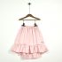 FALDA-MIDI-EN-SARGA-DE-ALGODÓN-ROSA-CON-VOLANTE-DELANTERO-SHORTISH